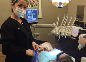 A dental assistant during  a routine dental check-up in Oceanside.